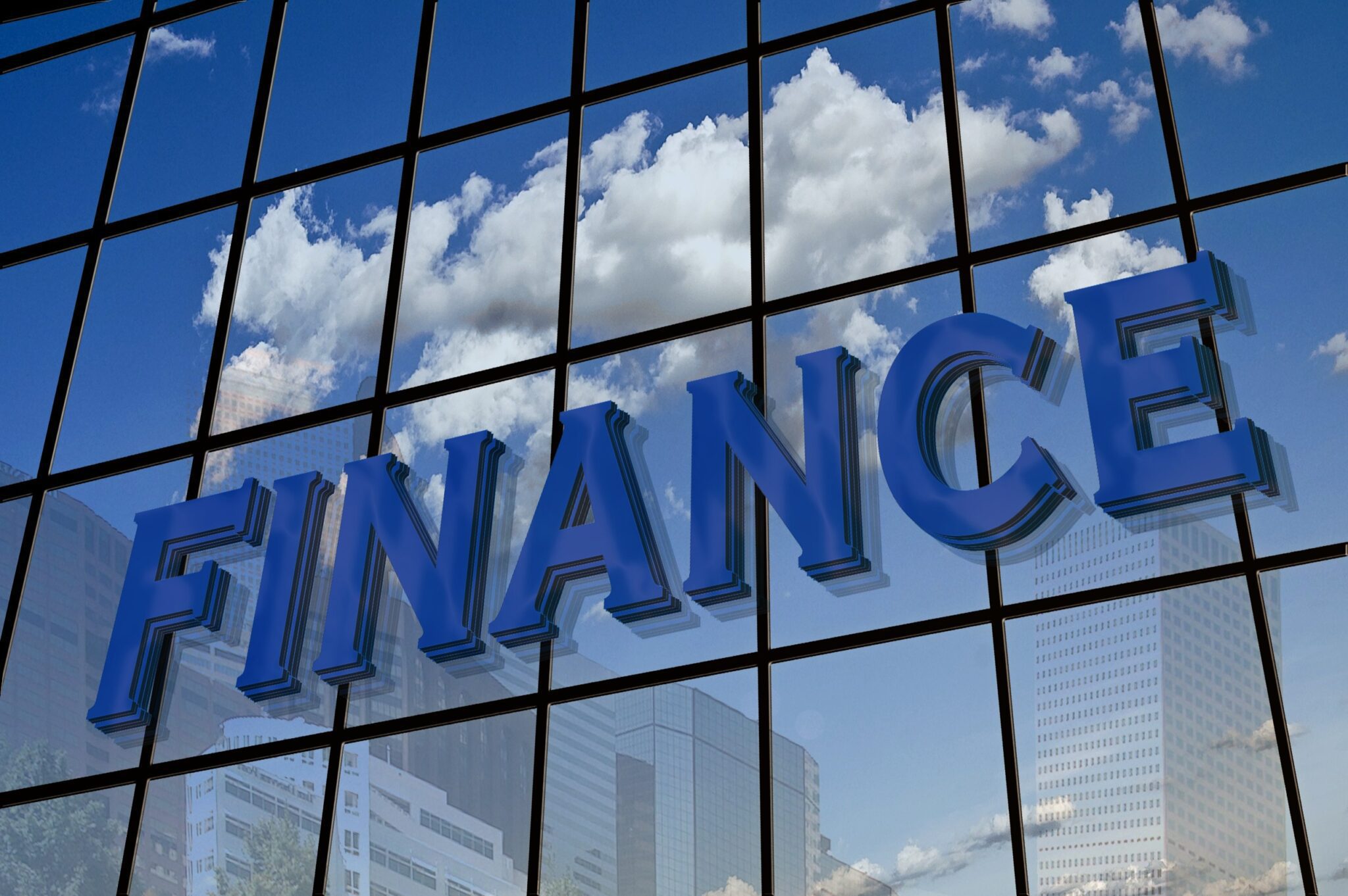 Image of glass building with close-up of finance sign